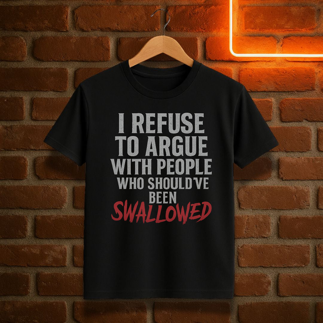 Black t-shirt with humorous text design on a brick wall background