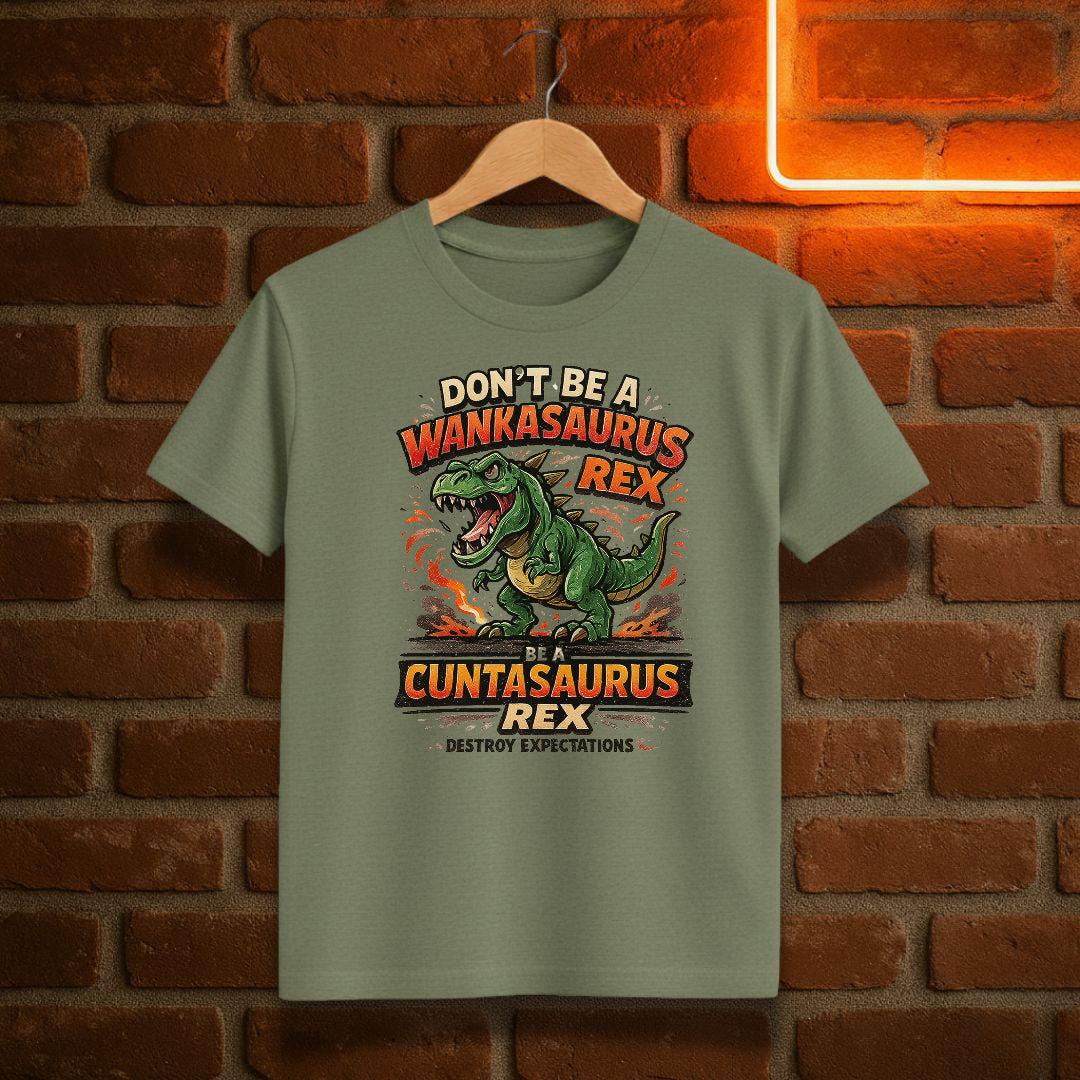 Light green t-shirt with a dinosaur graphic and text on a brick wall background