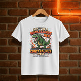 White t-shirt with a graphic design of a dinosaur and text on a brick wall background