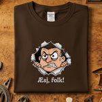 Æsj Folk T-Skjorte med kunstverk av sint karakter som bryter gjennom papp, trykket på Gildan 64000.