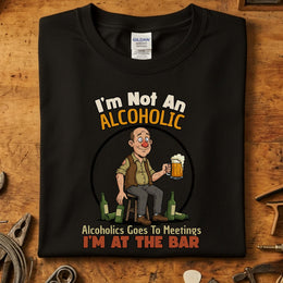 I’m Not An Alcoholic I’m At The Bar | Morsom Drikke T-Skjorte design featuring a humorous character with a beer.