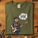 Oh You Play Guitar T-Skjorte featuring a cartoon character holding a bass guitar with a playful speech bubble.