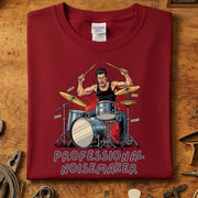 Professional Noisemaker T-Skjorte with drummer graphic on Gildan shirt, perfect for music lovers and vibrant style.